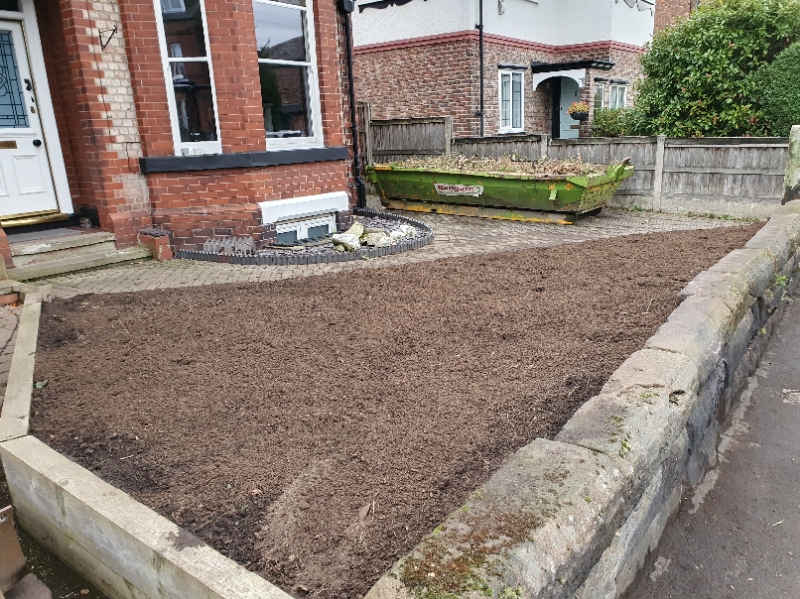 Image of empty shrub bed with smooth layer of top soil